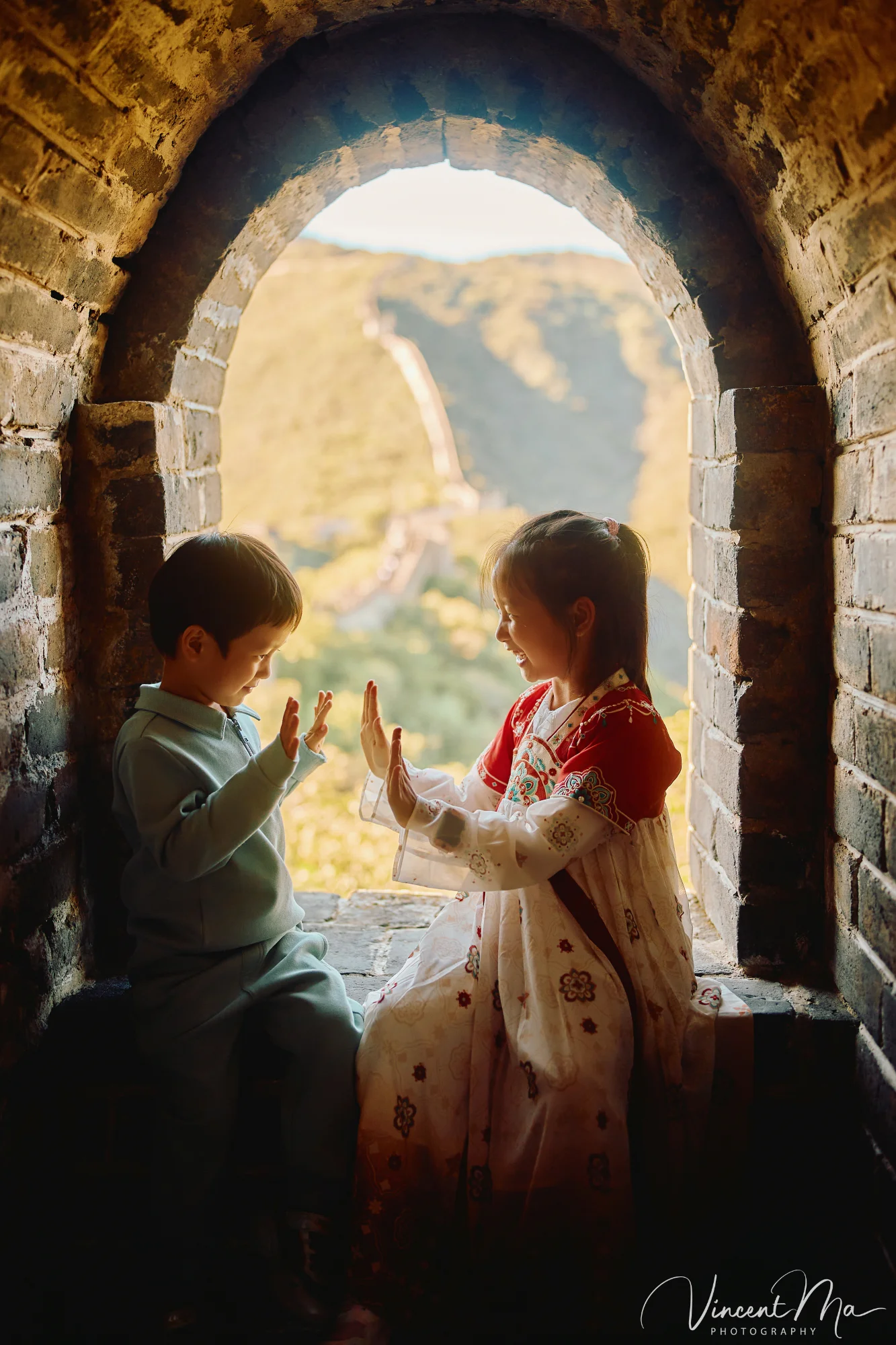 A panoramic view of the Mutianyu Great Wall during a family trip in the afternoon, showing the majestic wall winding through the mountains