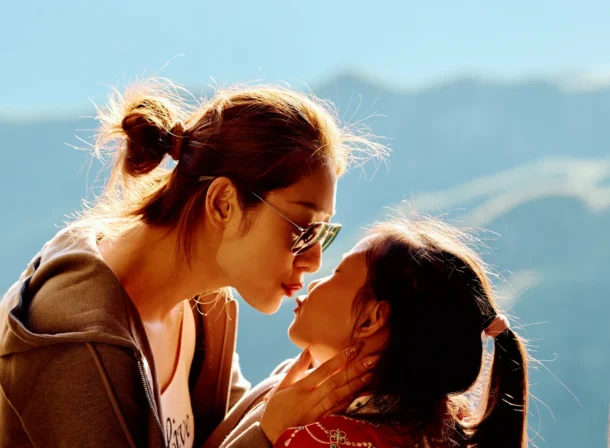 A panoramic view of the Mutianyu Great Wall during a family trip in the afternoon, showing the majestic wall winding through the mountains