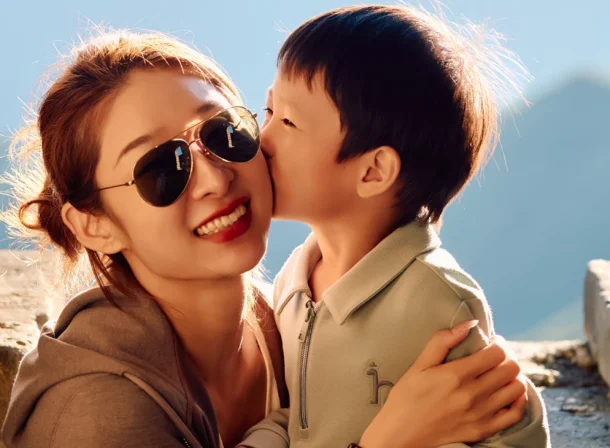 A panoramic view of the Mutianyu Great Wall during a family trip in the afternoon, showing the majestic wall winding through the mountains