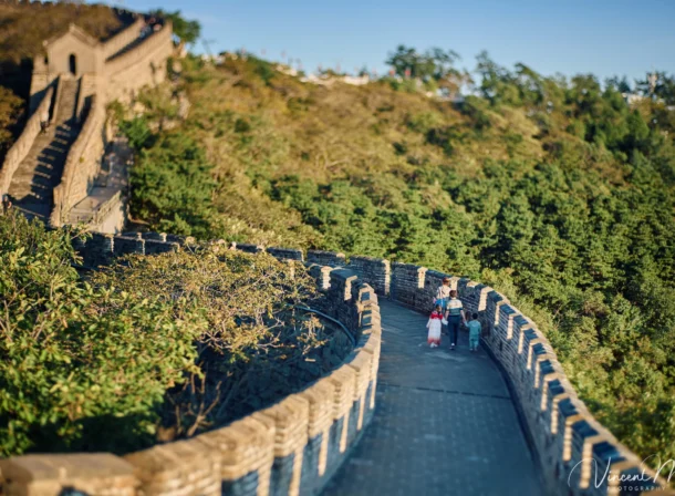 A panoramic view of the Mutianyu Great Wall during a family trip in the afternoon, showing the majestic wall winding through the mountains