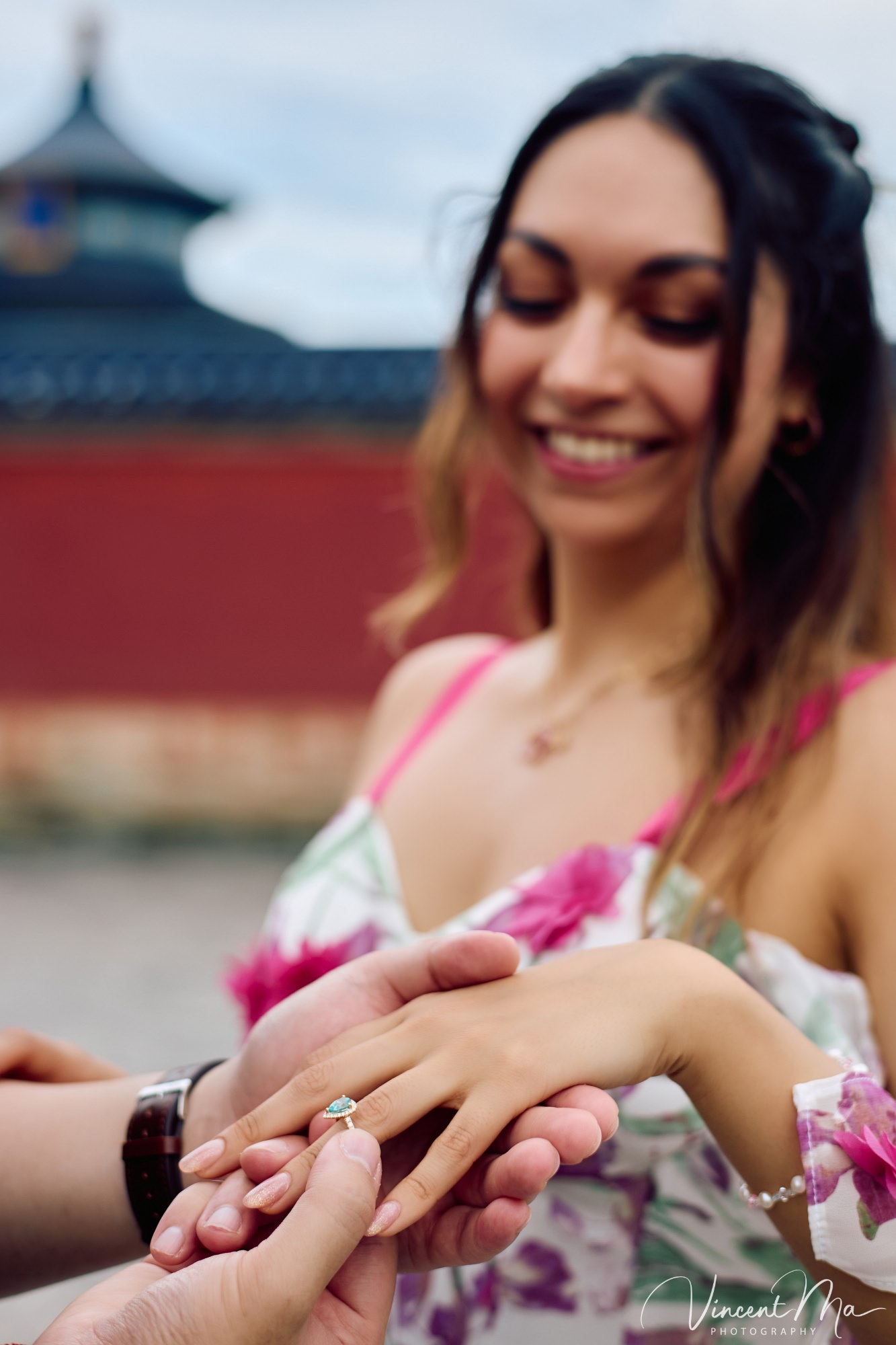 A foreign couple in traditional Chinese - style clothing, the man kneeling on one knee to propose to the woman in front of the majestic Hall of Prayer for Good Harvests in the Temple of Heaven