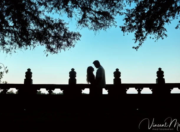 A couple shares an intimate moment with the magnificent architecture of the Summer Palace in Beijing in the background.