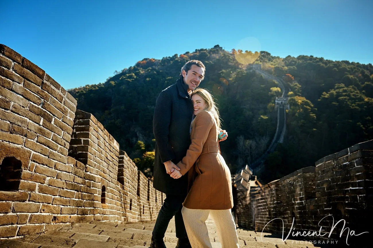 Man proposing to woman on Mutianyu Great Wall during autumn with mountains in background.Beijing photoshoot-Beijing photographer
