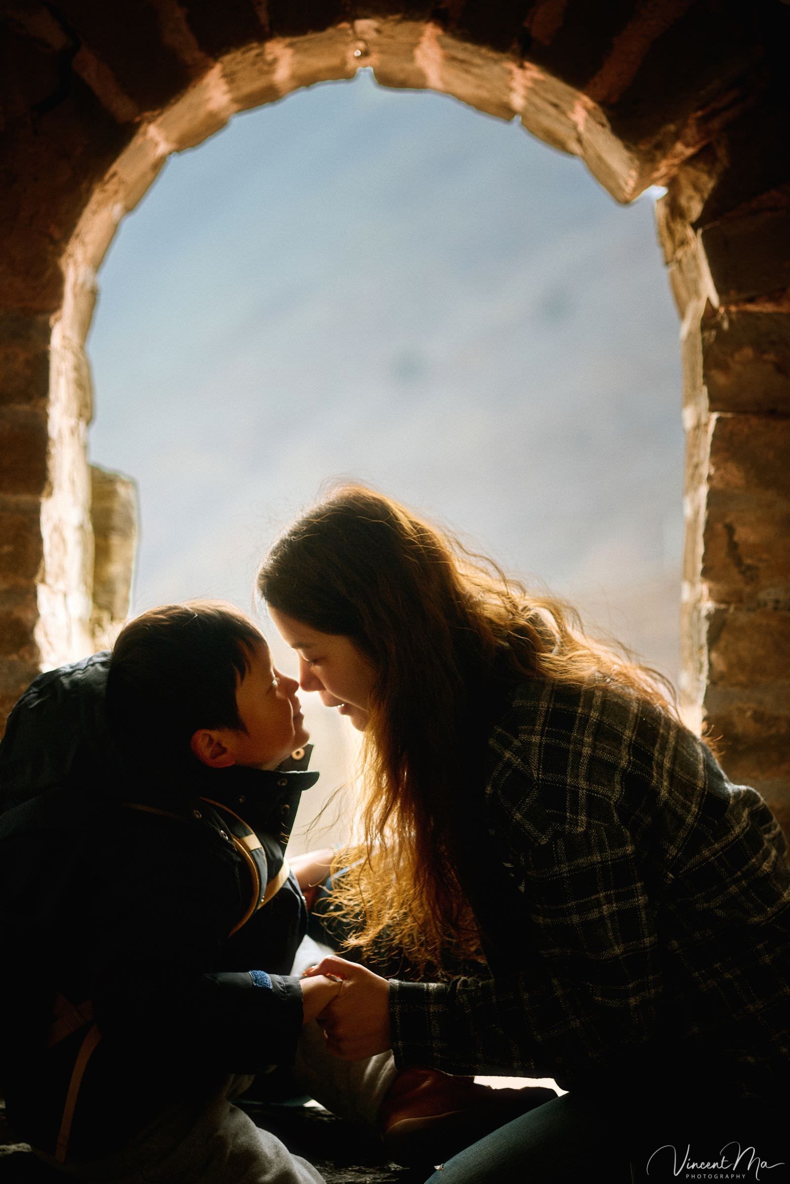 Mother and son exploring the Great Wall in winter