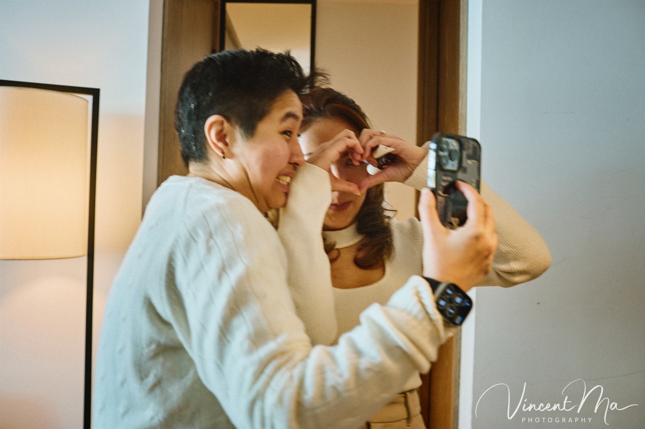 A cinematic and documentary photography series of Claire and April's same-sex winter elopement at Chongli Ski Resort, China. This minimalist wedding strips away traditional routines, featuring snowboarding in powder snow, intimate moments with their golden retrievers, and a legal online marriage ceremony via the Courtly platform by a cozy fireplace. Captured with a non-intrusive, lifestyle storytelling approach by Vincent Ma Visuals, a trusted LGBTQ-friendly photographer based in Beijing.