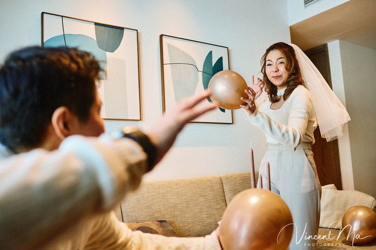 A cinematic and documentary photography series of Claire and April's same-sex winter elopement at Chongli Ski Resort, China. This minimalist wedding strips away traditional routines, featuring snowboarding in powder snow, intimate moments with their golden retrievers, and a legal online marriage ceremony via the Courtly platform by a cozy fireplace. Captured with a non-intrusive, lifestyle storytelling approach by Vincent Ma Visuals, a trusted LGBTQ-friendly photographer based in Beijing.