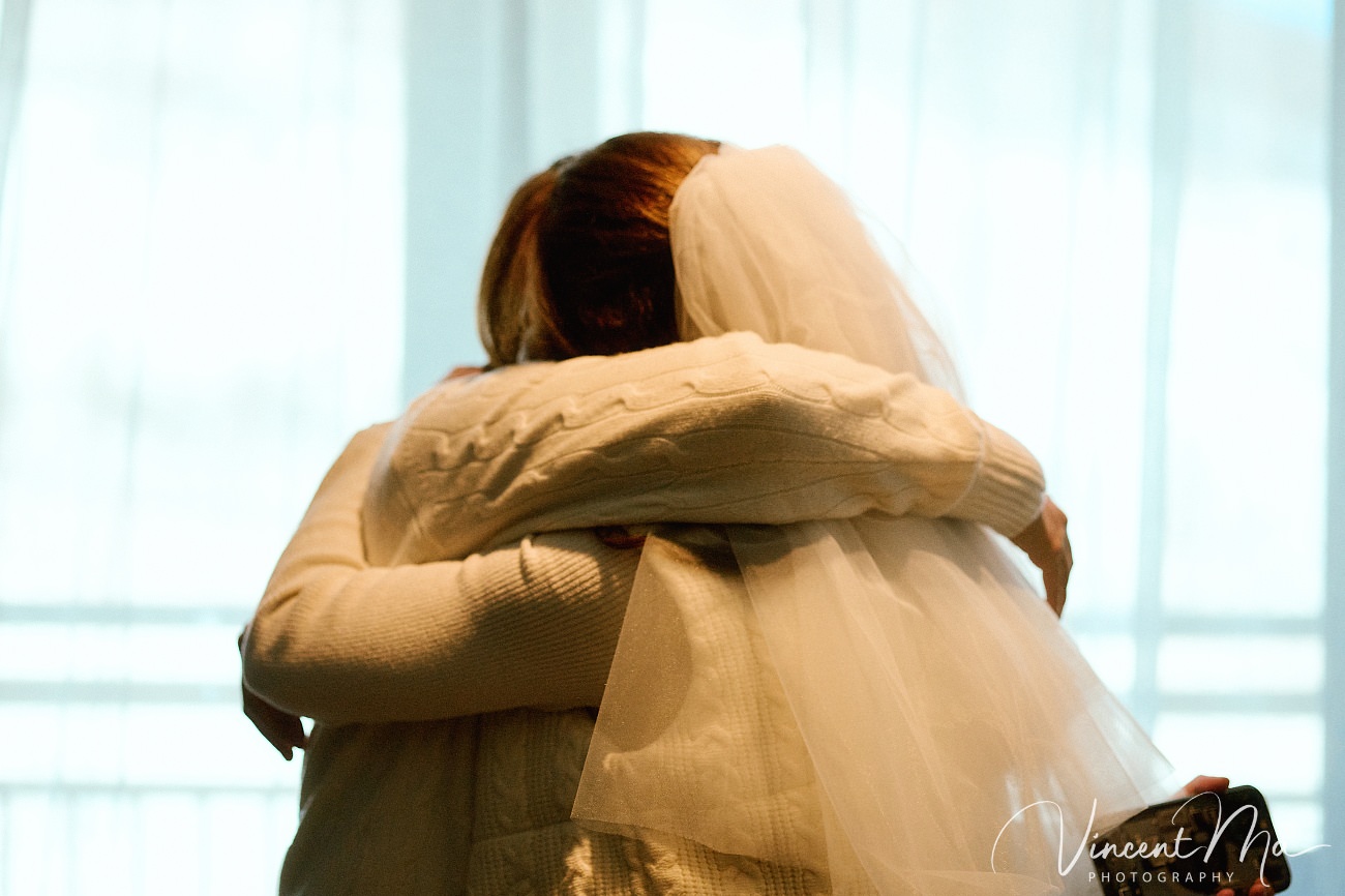 A cinematic and documentary photography series of Claire and April's same-sex winter elopement at Chongli Ski Resort, China. This minimalist wedding strips away traditional routines, featuring snowboarding in powder snow, intimate moments with their golden retrievers, and a legal online marriage ceremony via the Courtly platform by a cozy fireplace. Captured with a non-intrusive, lifestyle storytelling approach by Vincent Ma Visuals, a trusted LGBTQ-friendly photographer based in Beijing.