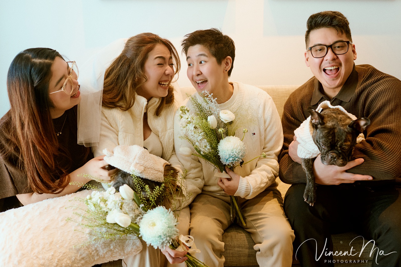 A cinematic and documentary photography series of Claire and April's same-sex winter elopement at Chongli Ski Resort, China. This minimalist wedding strips away traditional routines, featuring snowboarding in powder snow, intimate moments with their golden retrievers, and a legal online marriage ceremony via the Courtly platform by a cozy fireplace. Captured with a non-intrusive, lifestyle storytelling approach by Vincent Ma Visuals, a trusted LGBTQ-friendly photographer based in Beijing.