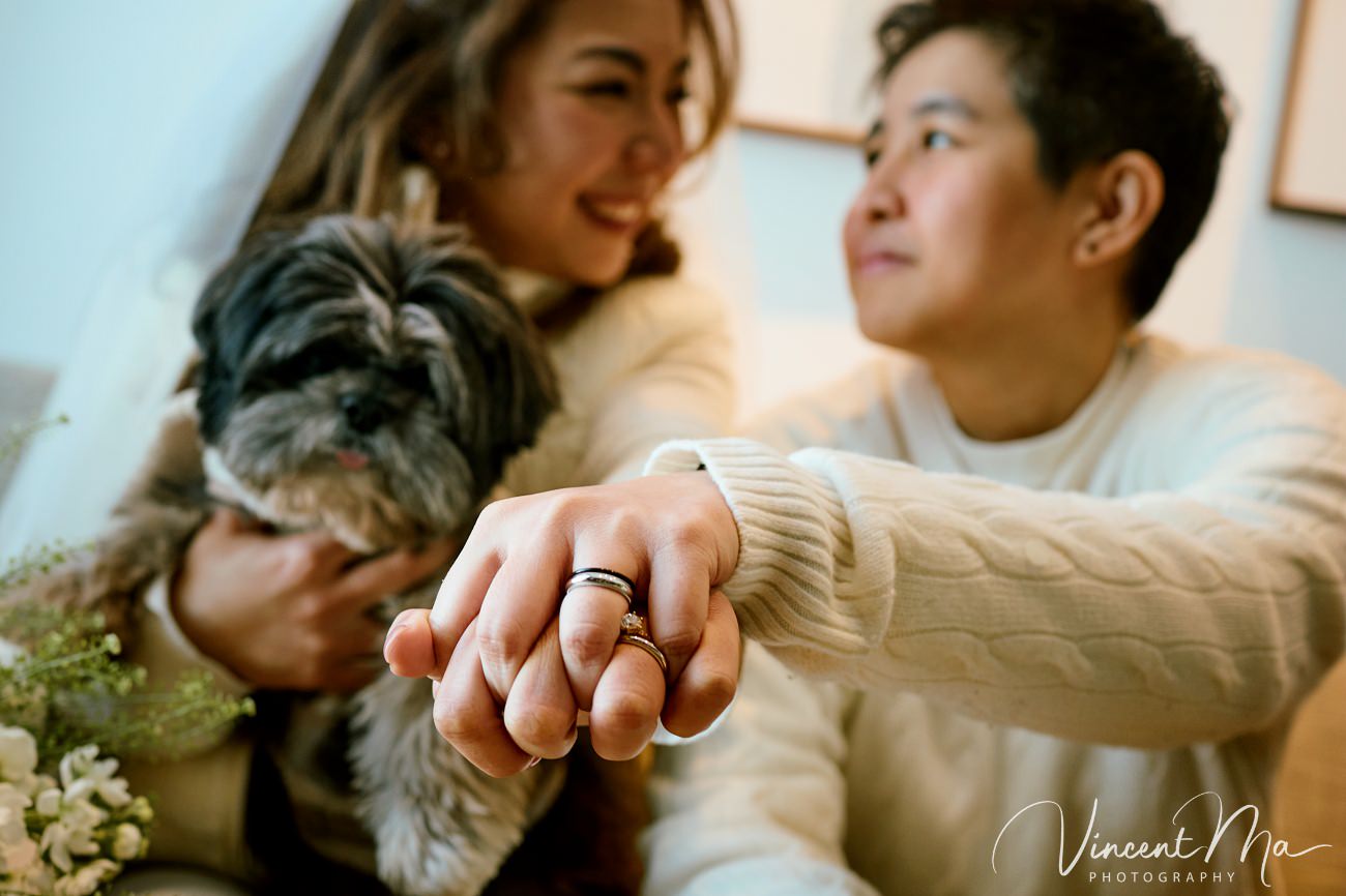 A cinematic and documentary photography series of Claire and April's same-sex winter elopement at Chongli Ski Resort, China. This minimalist wedding strips away traditional routines, featuring snowboarding in powder snow, intimate moments with their golden retrievers, and a legal online marriage ceremony via the Courtly platform by a cozy fireplace. Captured with a non-intrusive, lifestyle storytelling approach by Vincent Ma Visuals, a trusted LGBTQ-friendly photographer based in Beijing.