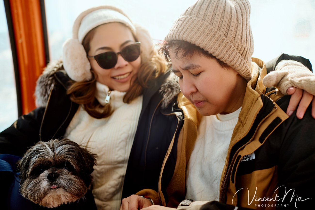 A cinematic and documentary photography series of Claire and April's same-sex winter elopement at Chongli Ski Resort, China. This minimalist wedding strips away traditional routines, featuring snowboarding in powder snow, intimate moments with their golden retrievers, and a legal online marriage ceremony via the Courtly platform by a cozy fireplace. Captured with a non-intrusive, lifestyle storytelling approach by Vincent Ma Visuals, a trusted LGBTQ-friendly photographer based in Beijing.