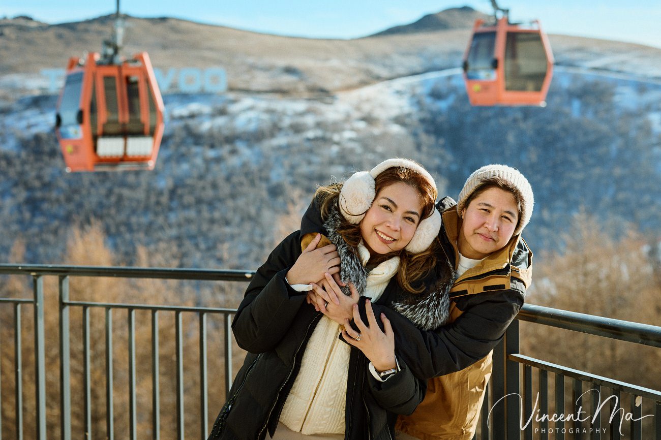 A cinematic and documentary photography series of Claire and April's same-sex winter elopement at Chongli Ski Resort, China. This minimalist wedding strips away traditional routines, featuring snowboarding in powder snow, intimate moments with their golden retrievers, and a legal online marriage ceremony via the Courtly platform by a cozy fireplace. Captured with a non-intrusive, lifestyle storytelling approach by Vincent Ma Visuals, a trusted LGBTQ-friendly photographer based in Beijing.