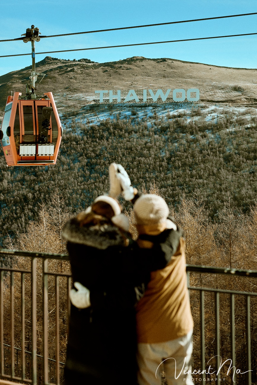 A cinematic and documentary photography series of Claire and April's same-sex winter elopement at Chongli Ski Resort, China. This minimalist wedding strips away traditional routines, featuring snowboarding in powder snow, intimate moments with their golden retrievers, and a legal online marriage ceremony via the Courtly platform by a cozy fireplace. Captured with a non-intrusive, lifestyle storytelling approach by Vincent Ma Visuals