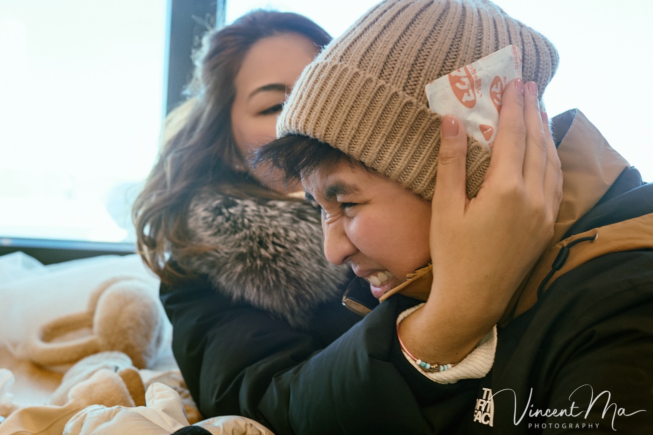 A cinematic and documentary photography series of Claire and April's same-sex winter elopement at Chongli Ski Resort, China. This minimalist wedding strips away traditional routines, featuring snowboarding in powder snow, intimate moments with their golden retrievers, and a legal online marriage ceremony via the Courtly platform by a cozy fireplace. Captured with a non-intrusive, lifestyle storytelling approach by Vincent Ma Visuals, a trusted LGBTQ-friendly photographer based in Beijing.