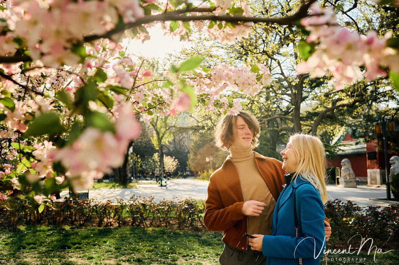 Mother and son from Germany enjoying spring blossoms at Ritan Park Beijing photoshoot
