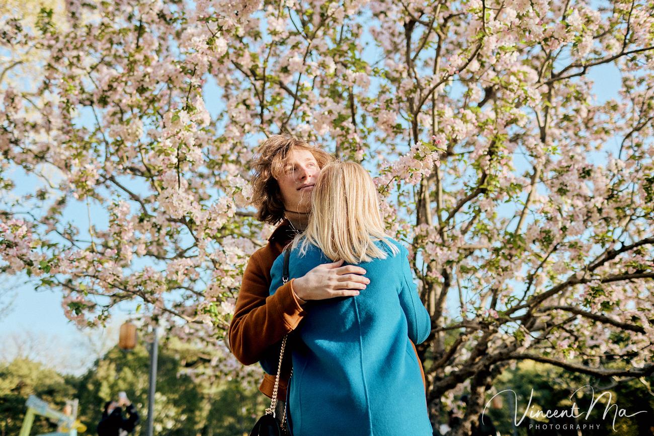 Mother and son from Germany enjoying spring blossoms at Ritan Park Beijing photoshoot