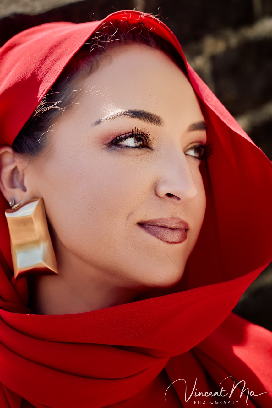 High-fashion portrait at the Great Wall of China. The contrast between modern silk textures and the weathered, ancient stone battlements of Mutianyu.