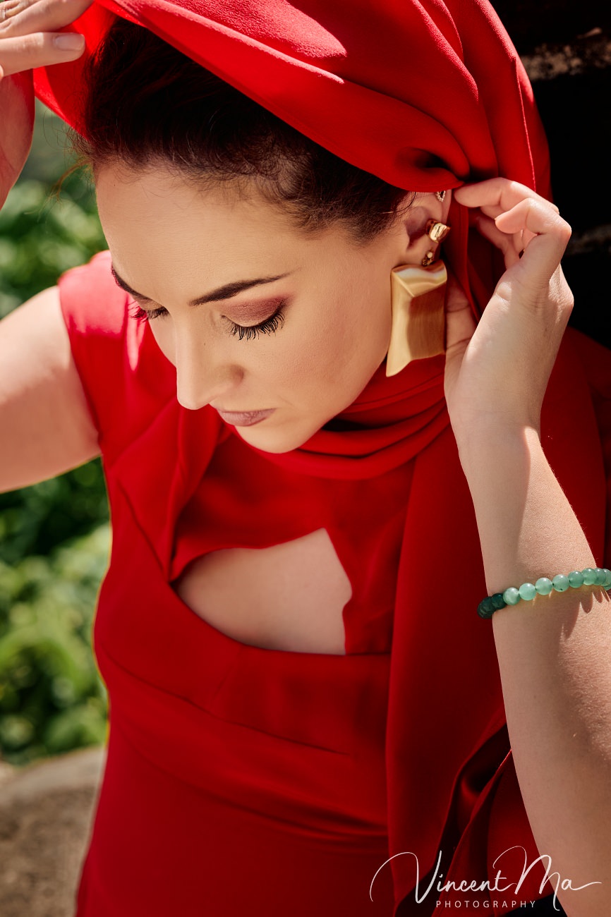 High-fashion portrait at the Great Wall of China. The contrast between modern silk textures and the weathered, ancient stone battlements of Mutianyu.
