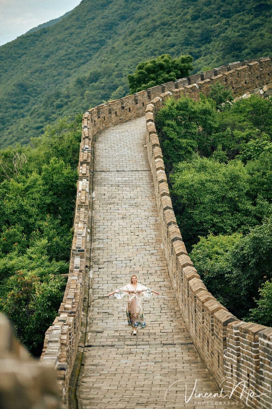 Expectant mother posing at the Hero Slope Tower 20 Mutianyu Great Wall at sunset.