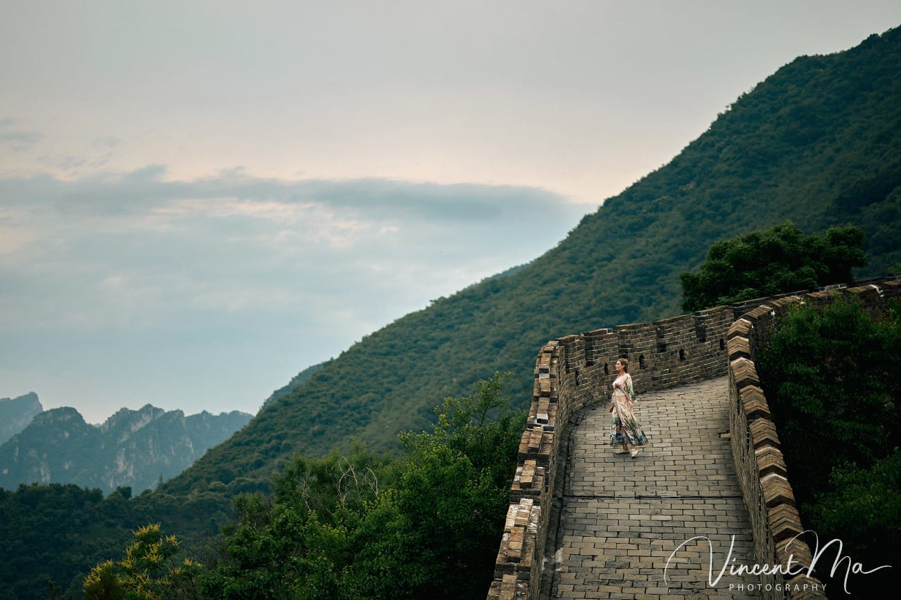 Expectant mother posing at the Hero Slope Tower 20 Mutianyu Great Wall at sunset.