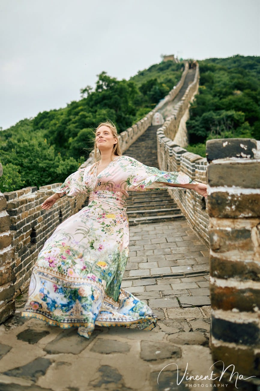 Expectant mother posing at the Hero Slope Tower 20 Mutianyu Great Wall at sunset.
