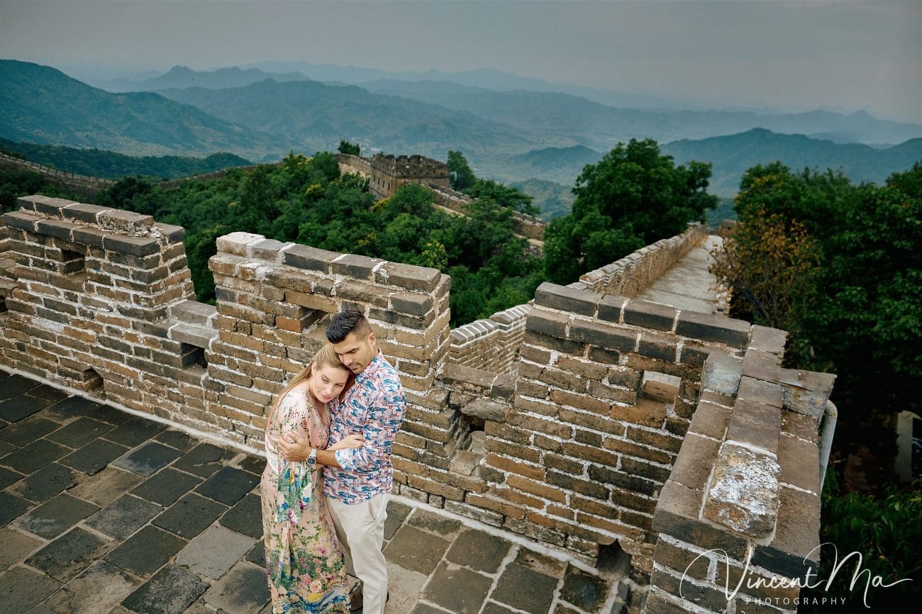 Expectant mother posing at the Hero Slope Tower 20 Mutianyu Great Wall at sunset.