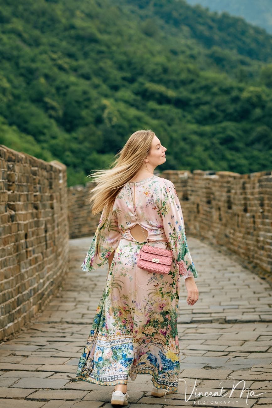 Expectant mother posing at the Hero Slope Tower 20 Mutianyu Great Wall at sunset.