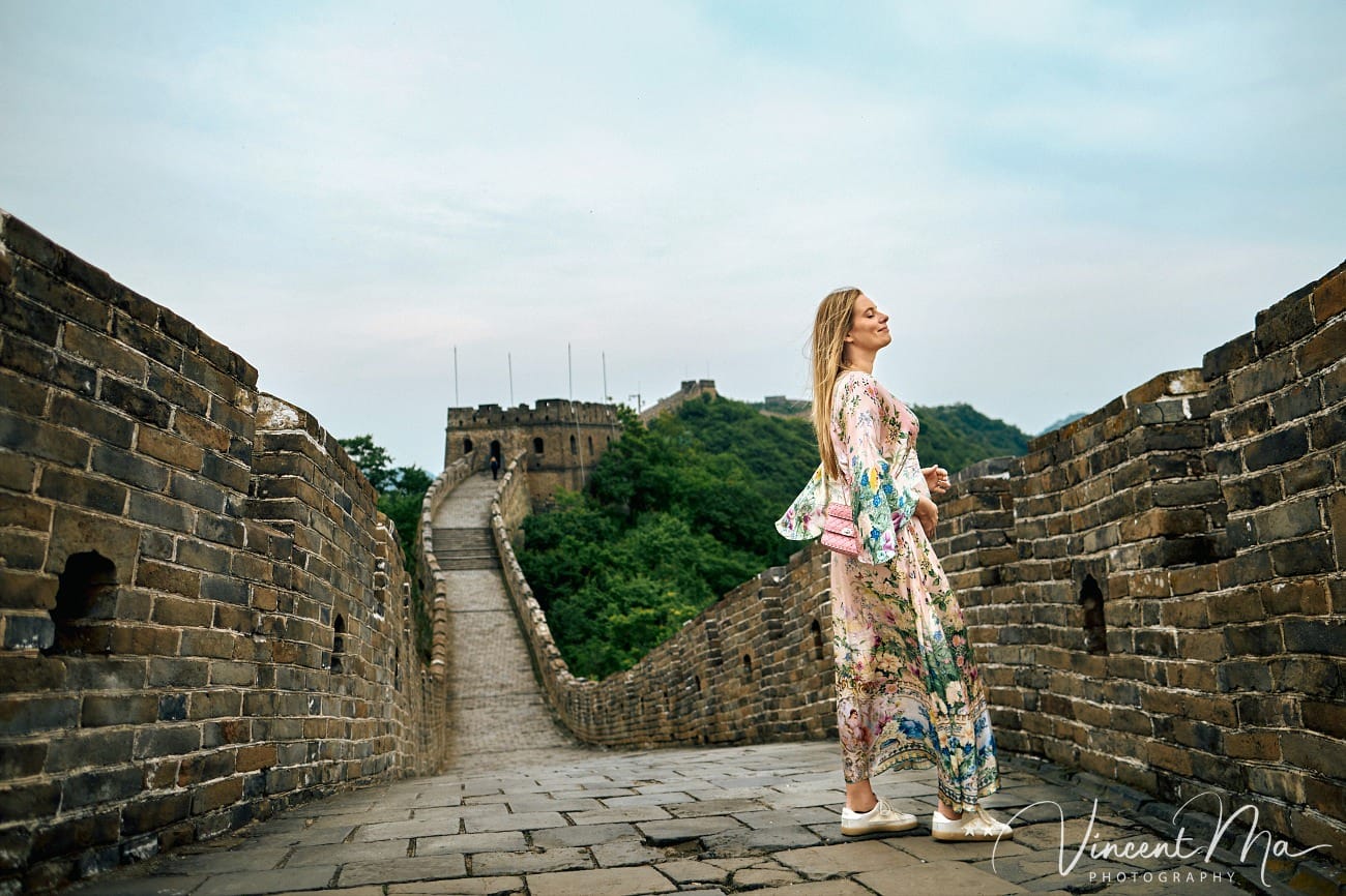 Expectant mother posing at the Hero Slope Tower 20 Mutianyu Great Wall at sunset.