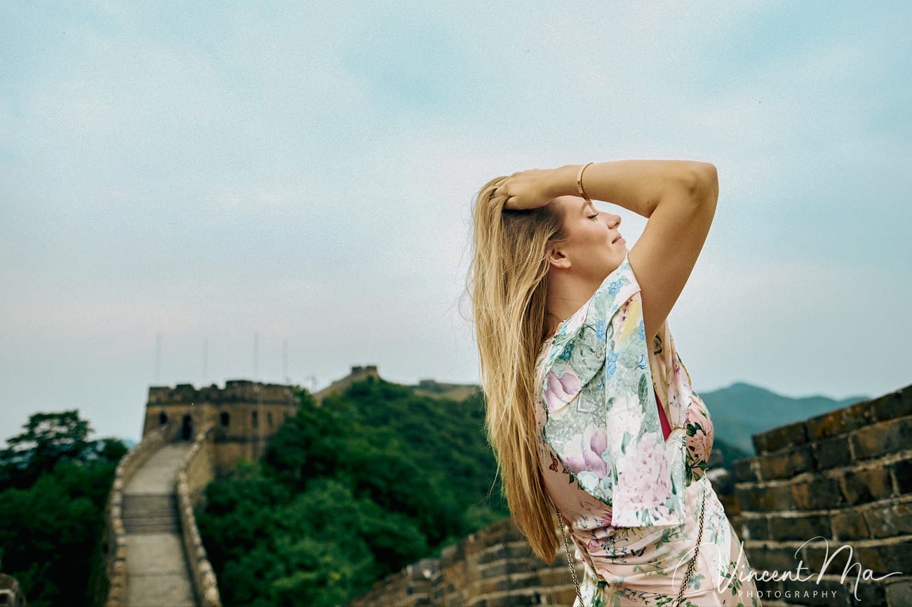 Expectant mother posing at the Hero Slope Tower 20 Mutianyu Great Wall at sunset.